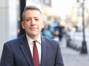Professional man in navy suit and red tie